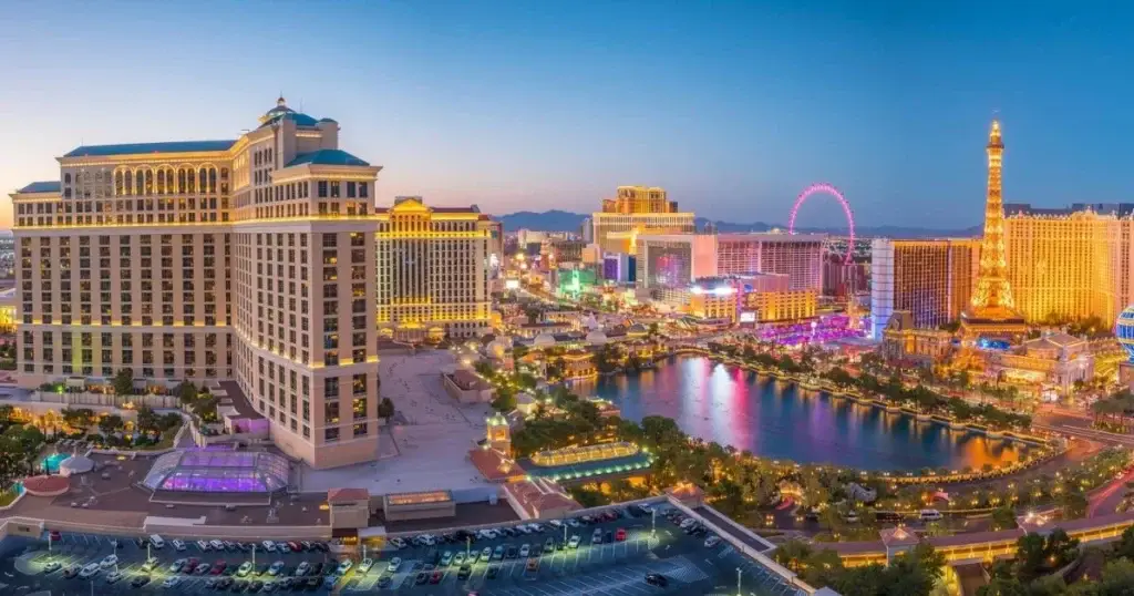 Travel essentials for planning your day trips from Las Vegas, including a map, backpack, and water bottle, set against a scenic desert backdrop